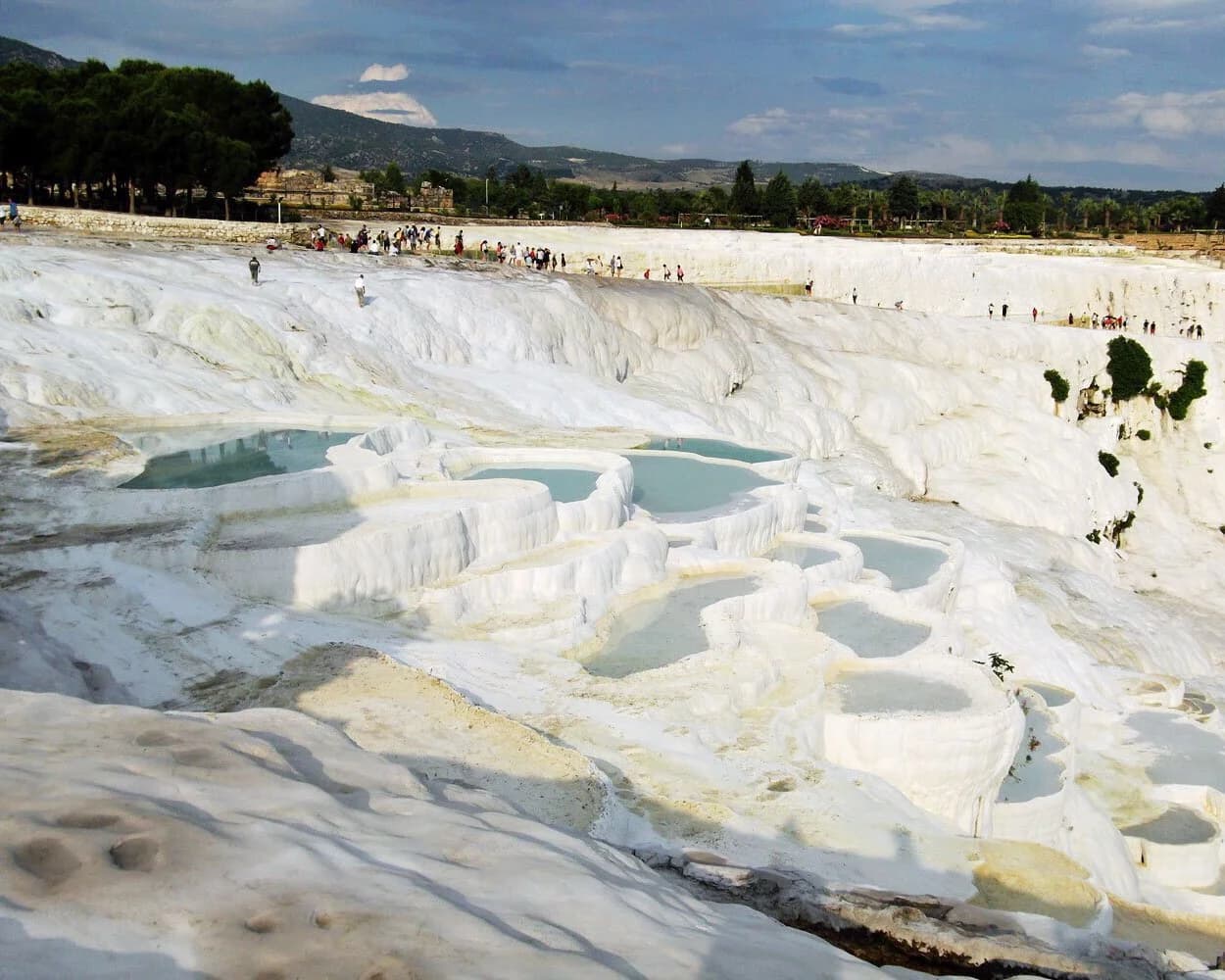 Natural travertine terraces forming at Pamukkale hot springs in Turkey showing geological formation process