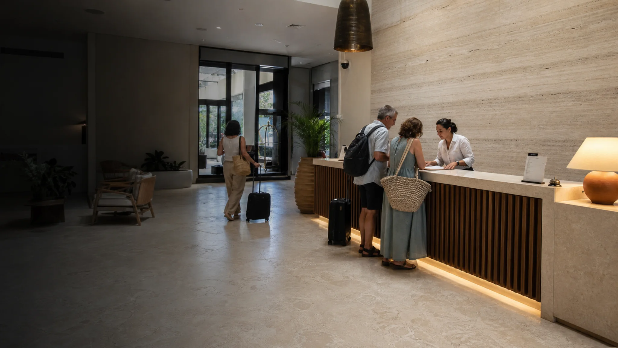 Active hotel lobby with a vein-cut travertine feature wall and cross-cut travertine floor