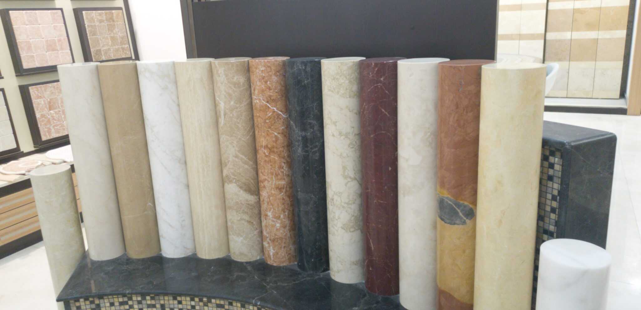 A showcase of various marble types arranged neatly in a store, highlighting their unique colors and patterns.