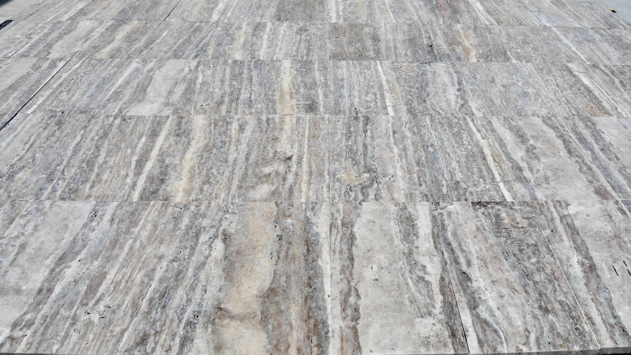 Vein-Cut Silver Travertine flooring with grey tones and linear vein patterns in matte finish Vein-Cut Silver Travertine flooring with grey tones and linear vein patterns in matte finish